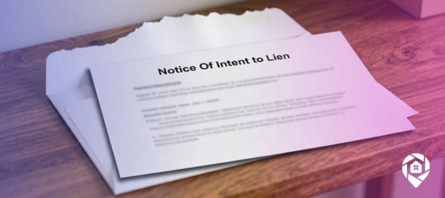Letter titled "Notice Of Intent to Lien" sitting on top of an open envelope