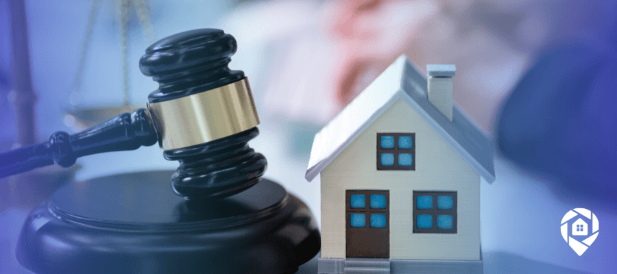 Gavel and small house model representing the legal authority of an attorney in fact to sign real estate documents.