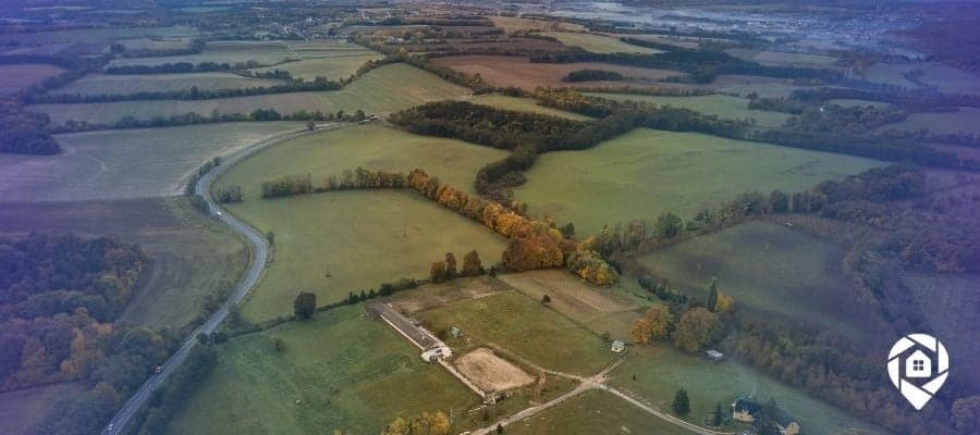 Aerial view of rural land ready for flipping, ideal for real estate investors exploring land investing strategies.