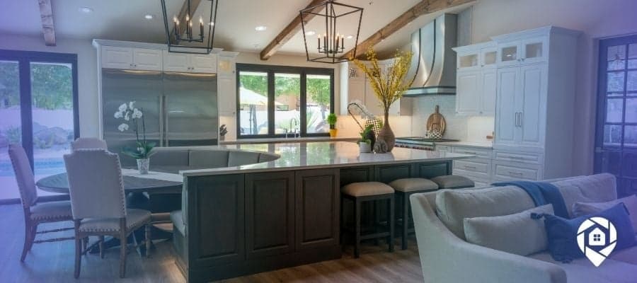 Modern open-concept kitchen in a wholesale real estate property with upscale finishes and natural light.