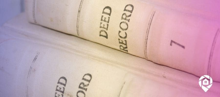 Two old books with Deed Record written on the spine