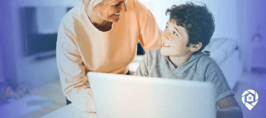 Mom building a real estate business from home while spending time with her child.