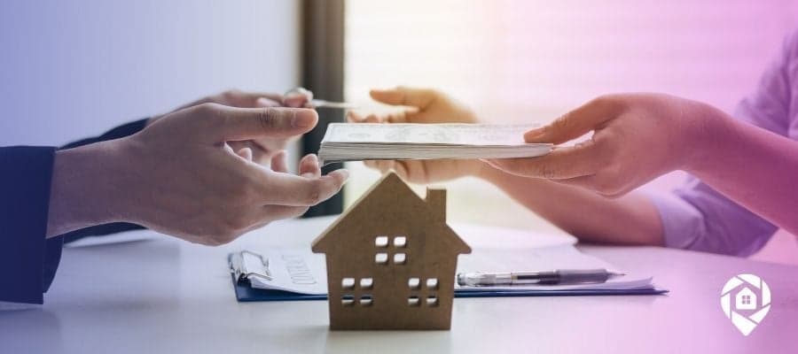 An exchange of money from a wholesaler and an investor home buyer.