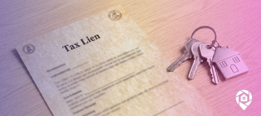 tax lien document with house keys on desk