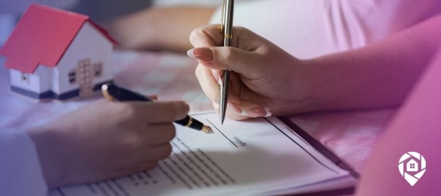 An investor and a homeowner going over a contract for an owner carry deal.